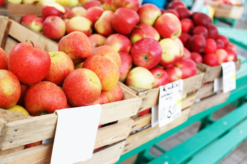 Red fresh apples in a wooden crate