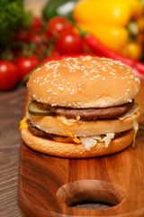 Close-up of a Big Mac on a wooden cutting board