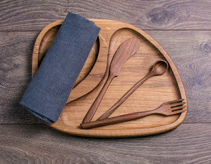 Wooden cutlery and a cloth
