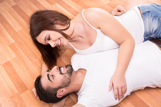 Couple relaxing on the floor