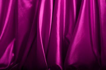 Pink silk background close up