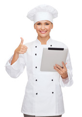 smiling female chef with tablet pc computer