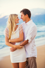 Couple Enjoying Sunset on the Beach