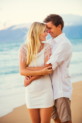 Couple Enjoying Sunset on the Beach