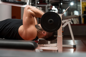 Muscular Man Exercising Triceps