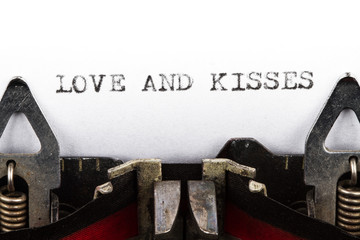 Typewriter with text love and kisses - 60770907