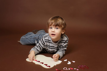 Child making Valentine's Day Craft with Hearts