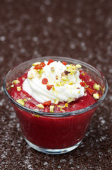 dessert with strawberry jam and whipped cream closeup