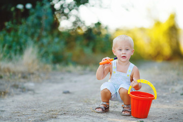 Little smiling boy fishing outdoors
