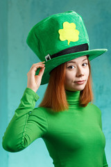 Red hair girl in Saint Patrick's Day leprechaun party hat
