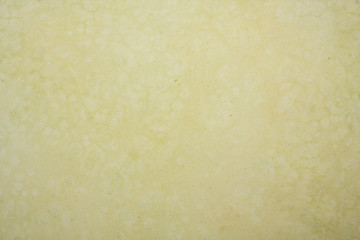 Dirty yellow tinted textured paper