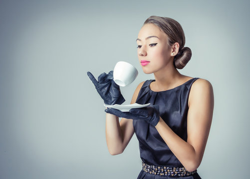 Vintage beautiful fashion girl with coffee cup