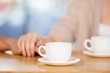 Couple holding hands.