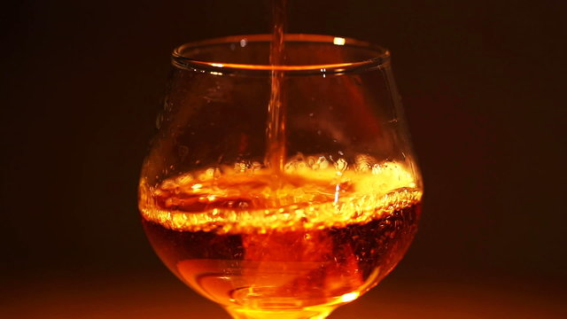 Cognac, brandy is poured