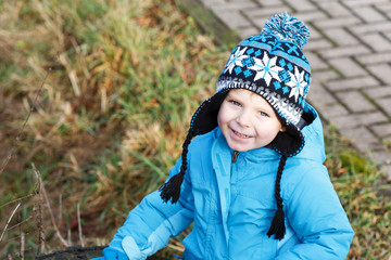 Portrait of little boy of two years outdoor