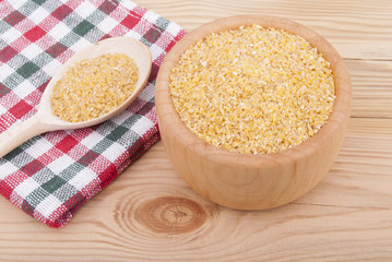 Wheat cereal in a bowl on the table.