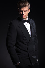 side view of a fashion man in tuxedo looking away