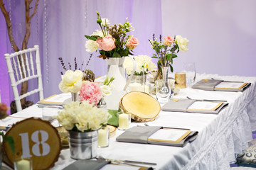 Elegant table set in green and white for wedding or event party.