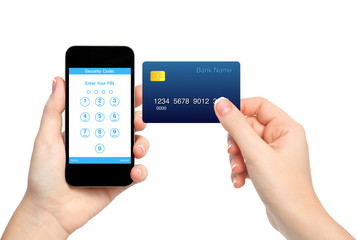 isolated female hands holding phone and credit card and enter a