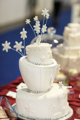 Beautiful wedding cake in white with snowflokes .