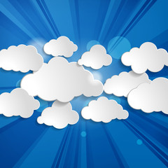 Abstract speech bubbles in the shape of clouds with rays on a bl