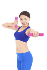 Young woman working out with dumbbells in her hands