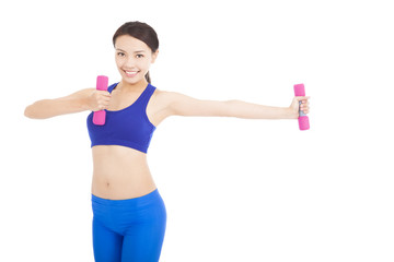 Fototapeta na wymiar Young attractive sporty woman with dumbbells
