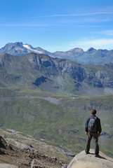 Fototapeta premium Tourist against the green mountains.