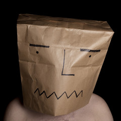 Man with paper bag in head