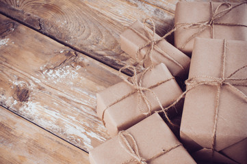 Fototapeta na wymiar gift boxes, postal parcels on wooden board
