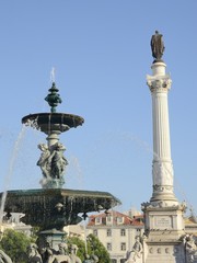 Fototapeta na wymiar Fountain in Rossio Square, Lisbon, Portugal