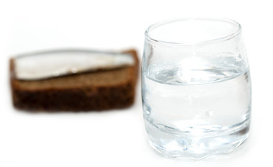 a shot of vodka with a fish on bread