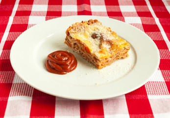 Portion of tasty lasagna on a plate