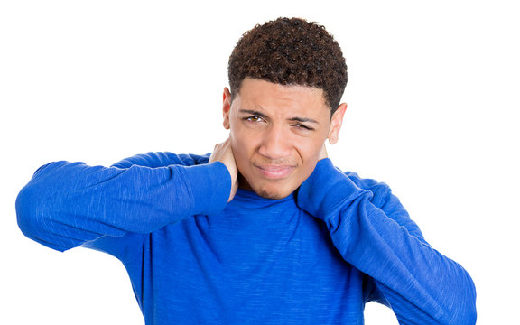Stressed young man with neck pain isolated on white background 