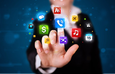 Woman pressing various collection of high tech buttons