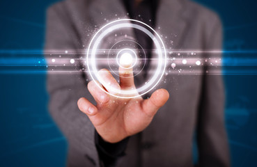 Businessman pressing high tech type of modern buttons