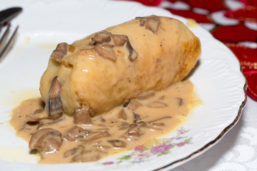 cabbage stuffed roll with mushroom sauce