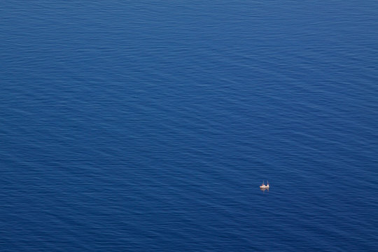 Seascape With Tiny Fishing Boat