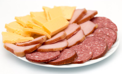 Sausage and cheese on plate isolated on white