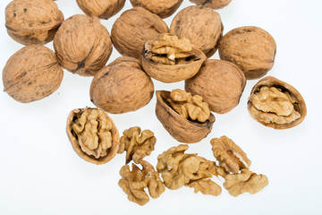 walnut and a cracked walnut isolated on the white background