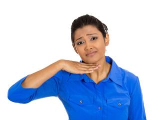 Young woman gesturing with hand to stop talking, cut it out