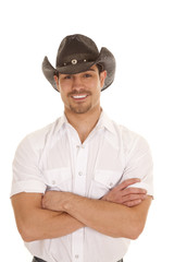 cowboy arms crossed smile white shirt