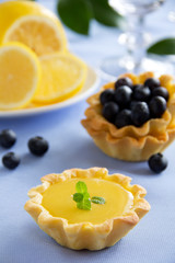 Delicious tarts with lemon cream and blueberries.