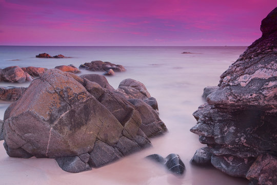 Purple skies over ocean