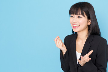 asian businesswoman interviewing on blue background