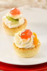 Small fruit tart with vanilla frosting