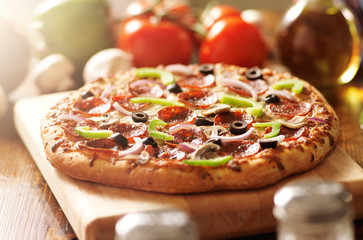 supreme italian pizza with pepperoni and toppings