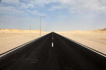 Road through the desert in western Qatar, Middle East