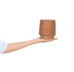 hand holding bamboo rice box