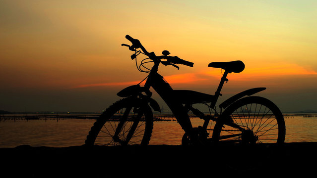 Mountain bike silhouette with sunset sky